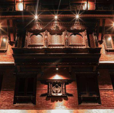 a room with a brick building with lights on it at Indrayani Boutique Hotel & Cafe in Bhaktapur
