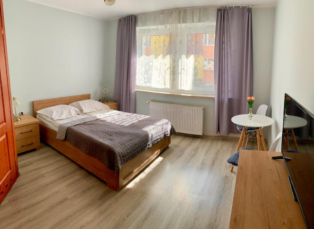 Posteľ alebo postele v izbe v ubytovaní Portowa 35