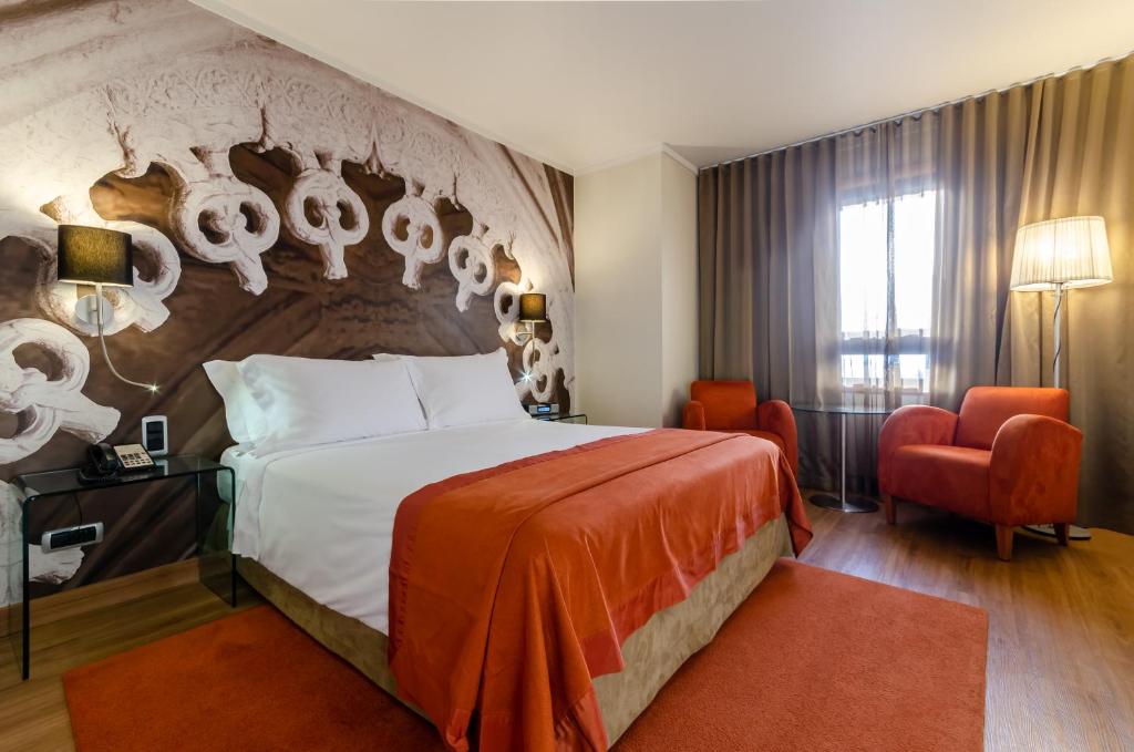 Postel nebo postele na pokoji v ubytování Hotel Marques De Pombal
