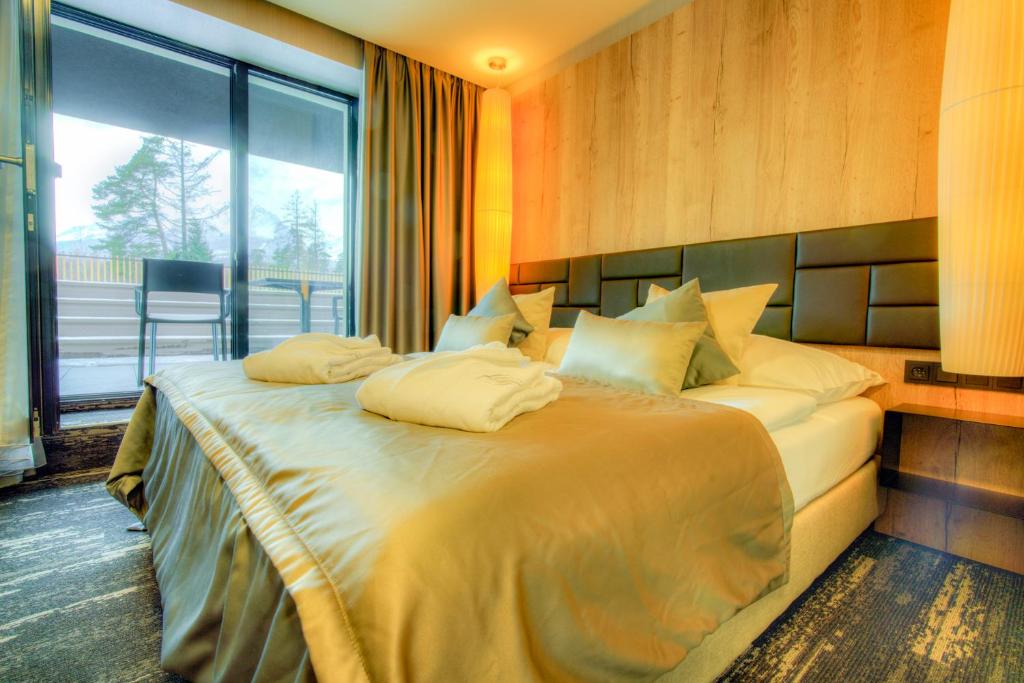 Postel nebo postele na pokoji v ubytování Hotel Hills
