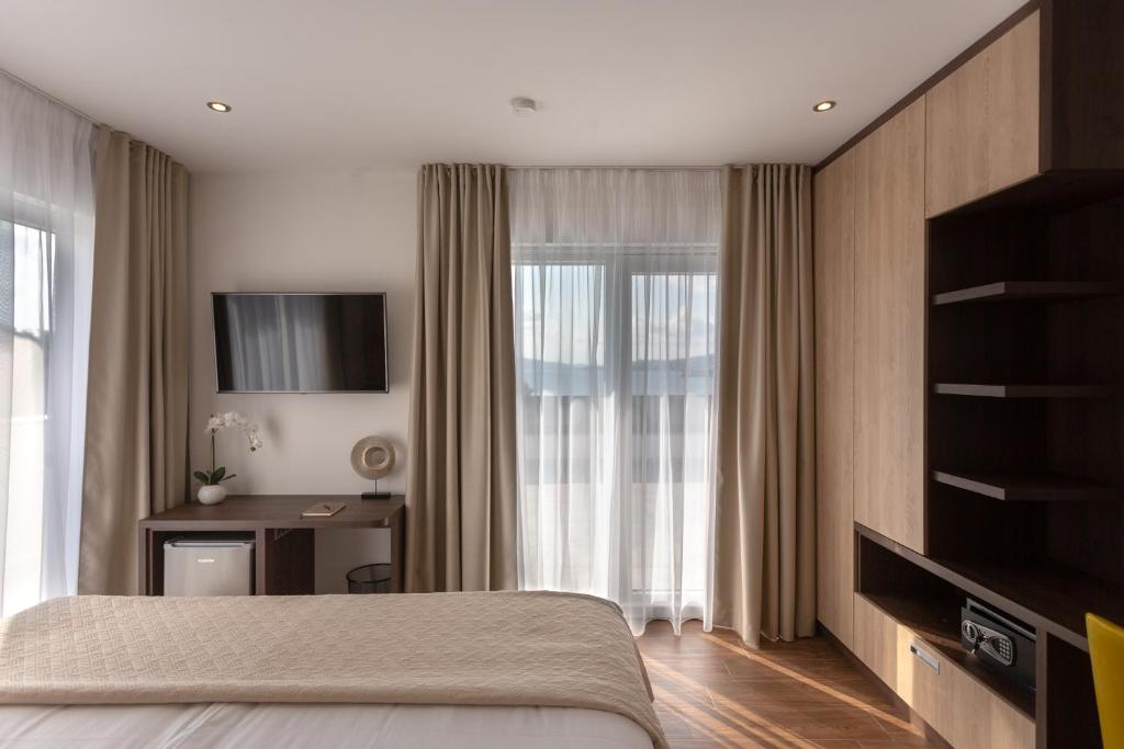 Postel nebo postele na pokoji v ubytování Villa Fortis B&B