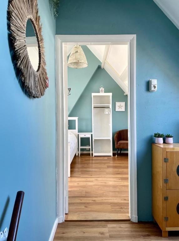 Een bed of bedden in een kamer bij Divi Divi Zandvoort
