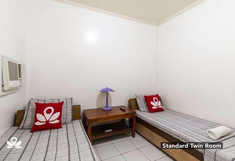 Postel nebo postele na pokoji v ubytování COFFEESWINGS LODGING HOUSE
