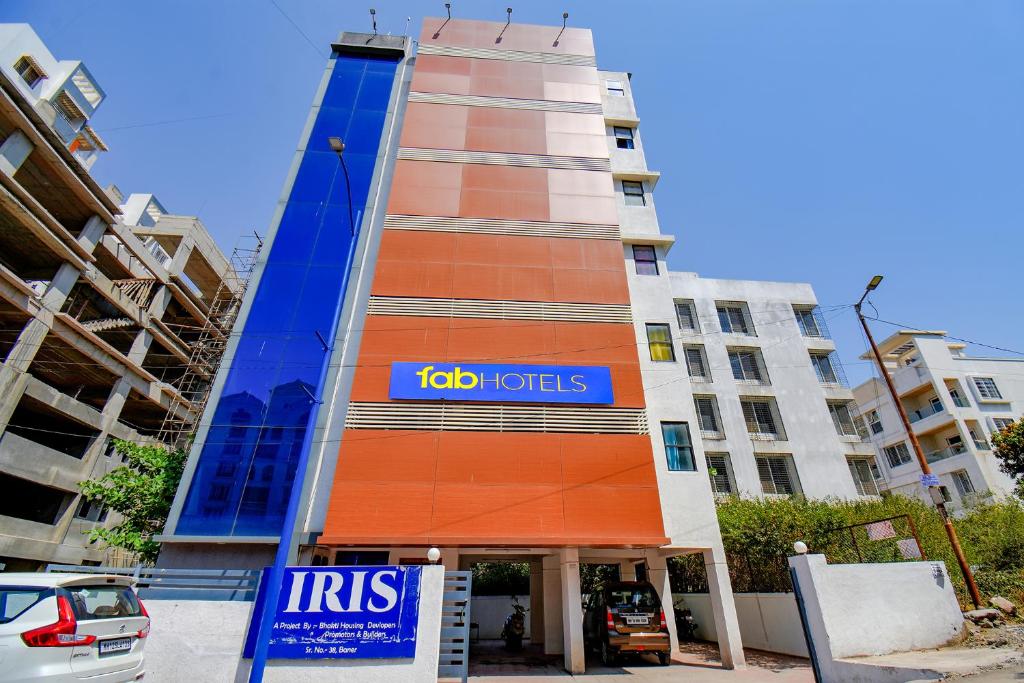 a building with atoc tots sign on the side of it at FabHotel Aakiyo in Pune