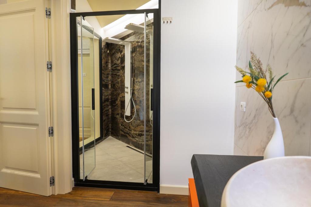 a glass door leading to a shower in a bathroom at Luxury B&B La Riserva Dannunziana in Pescara