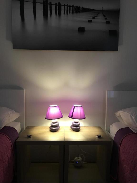 Posteľ alebo postele v izbe v ubytovaní Momentum Apartment