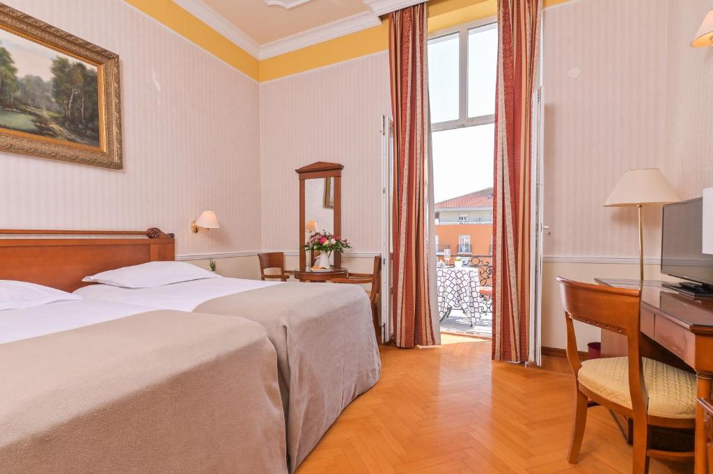 Posteľ alebo postele v izbe v ubytovaní Hotel Continental