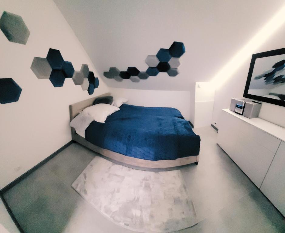 Katil atau katil-katil dalam bilik di Apartament POD STRZECHĄ