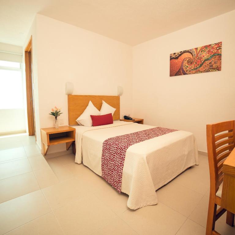 Postel nebo postele na pokoji v ubytování Hotel Klimt