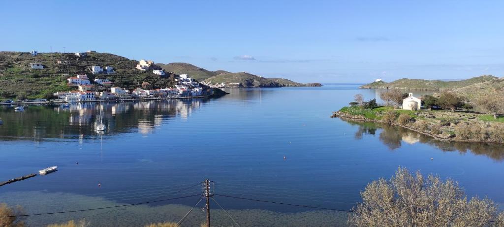 a large body of water with houses on the islands at Vourkari, modern apartment overlooking the Marina of Vourkari in Vourkarion