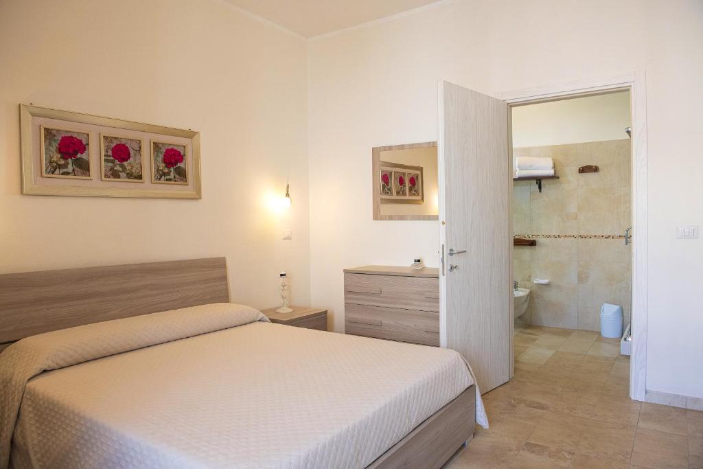 Postel nebo postele na pokoji v ubytování B&B I Gerani