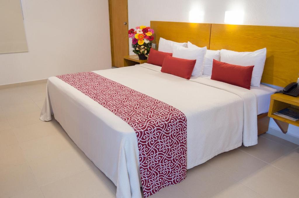 Postel nebo postele na pokoji v ubytování Hotel Klimt