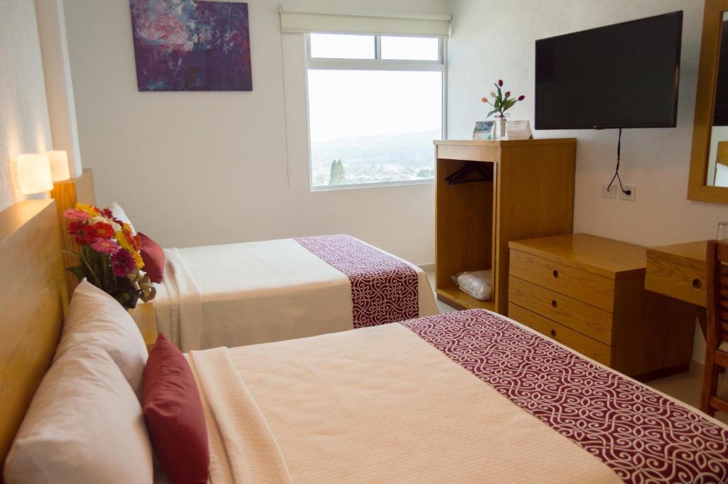 Postel nebo postele na pokoji v ubytování Hotel Klimt