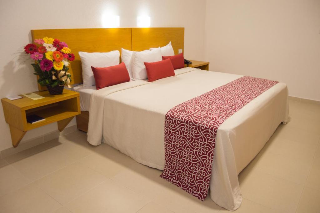Postel nebo postele na pokoji v ubytování Hotel Klimt