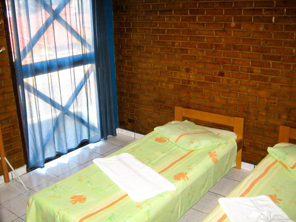 เตียงในห้องที่ Apart-Hotel Marinas da Lagoa - 2 Praias a 4 Min -