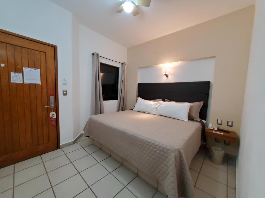 Postel nebo postele na pokoji v ubytování Hotel El Relicario