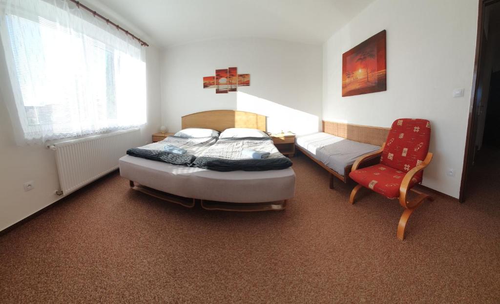 Postel nebo postele na pokoji v ubytování Holiday Home U Čápů