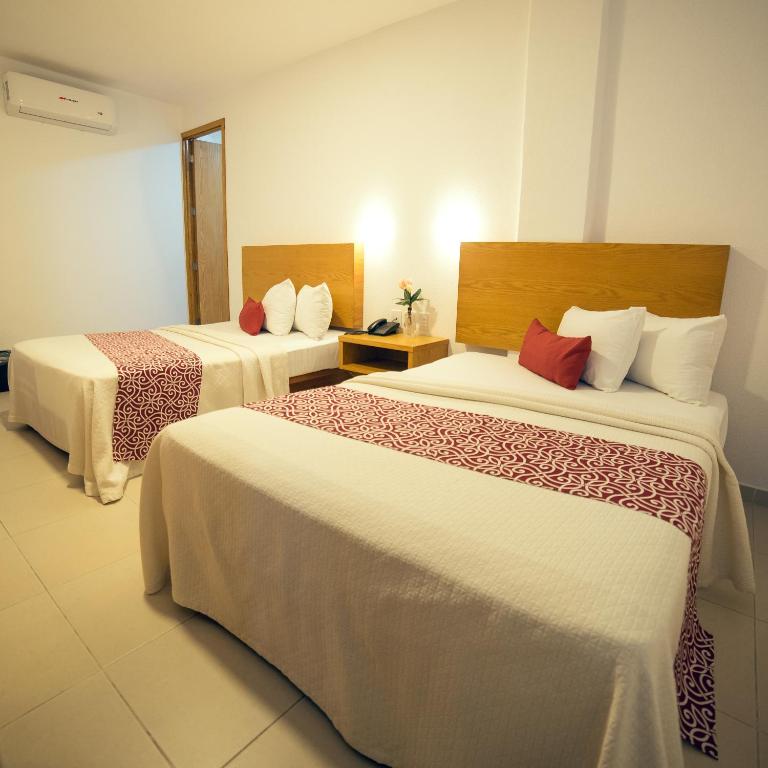 Postel nebo postele na pokoji v ubytování Hotel Klimt