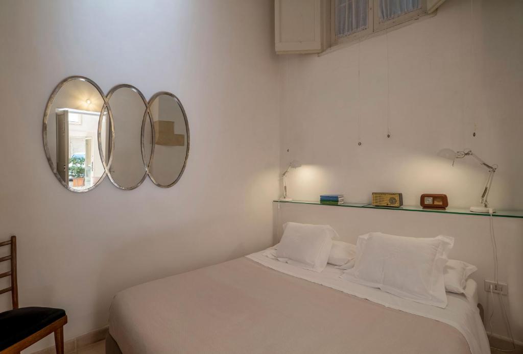 Postel nebo postele na pokoji v ubytování B&B Corte Dei Romiti - Lecce Selection