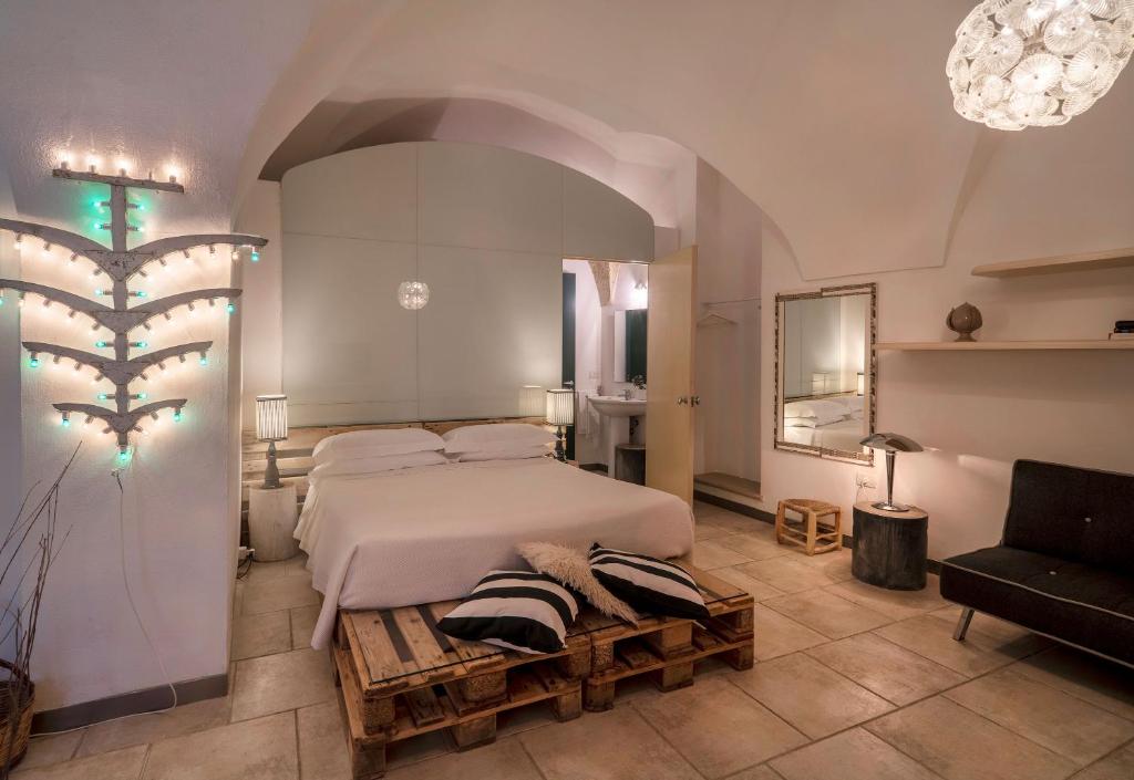 Postel nebo postele na pokoji v ubytování B&B Corte Dei Romiti - Lecce Selection