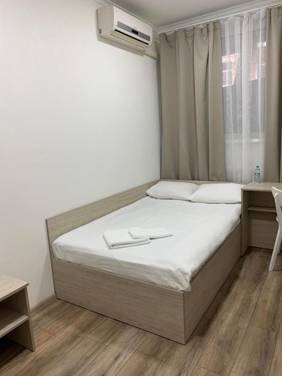 Postel nebo postele na pokoji v ubytování Міні-Готель Білий Квадрат