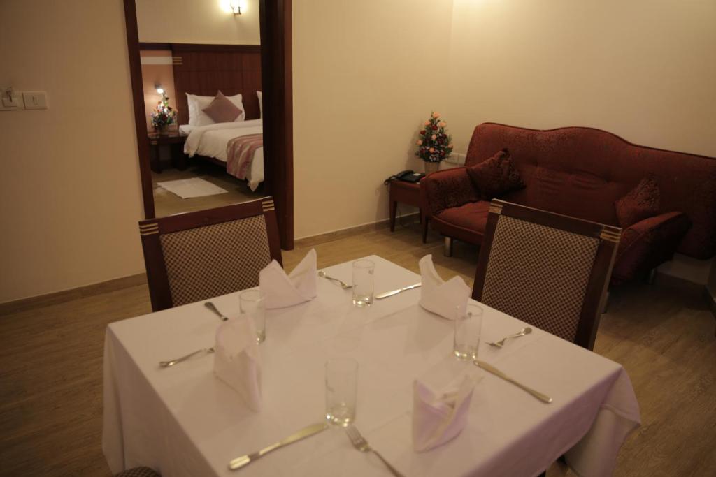 Postel nebo postele na pokoji v ubytování Rain Drops Hotel