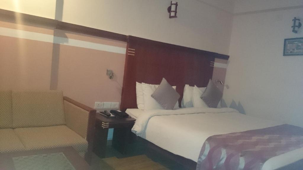 Postel nebo postele na pokoji v ubytování Rain Drops Hotel