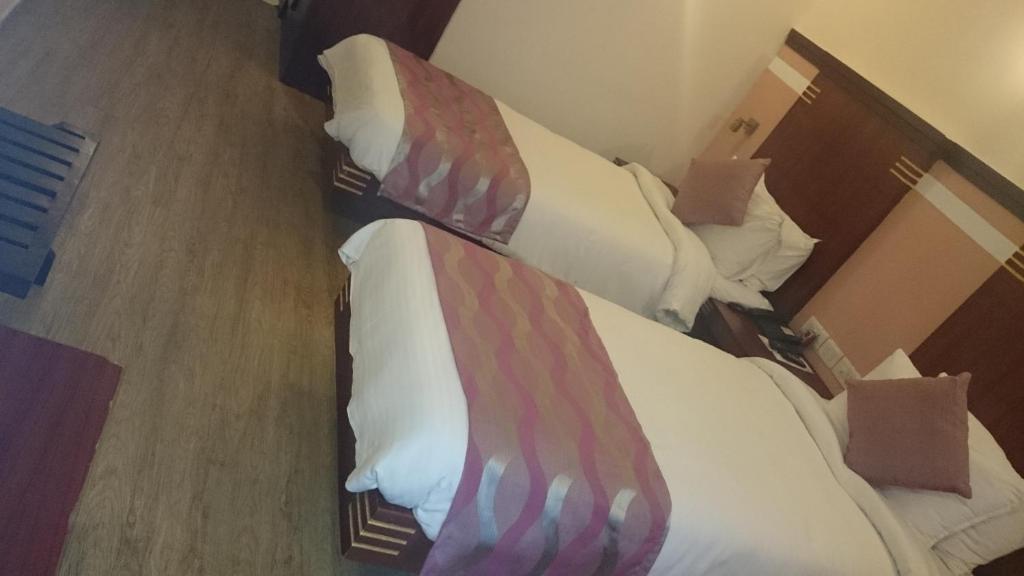 Postel nebo postele na pokoji v ubytování Rain Drops Hotel