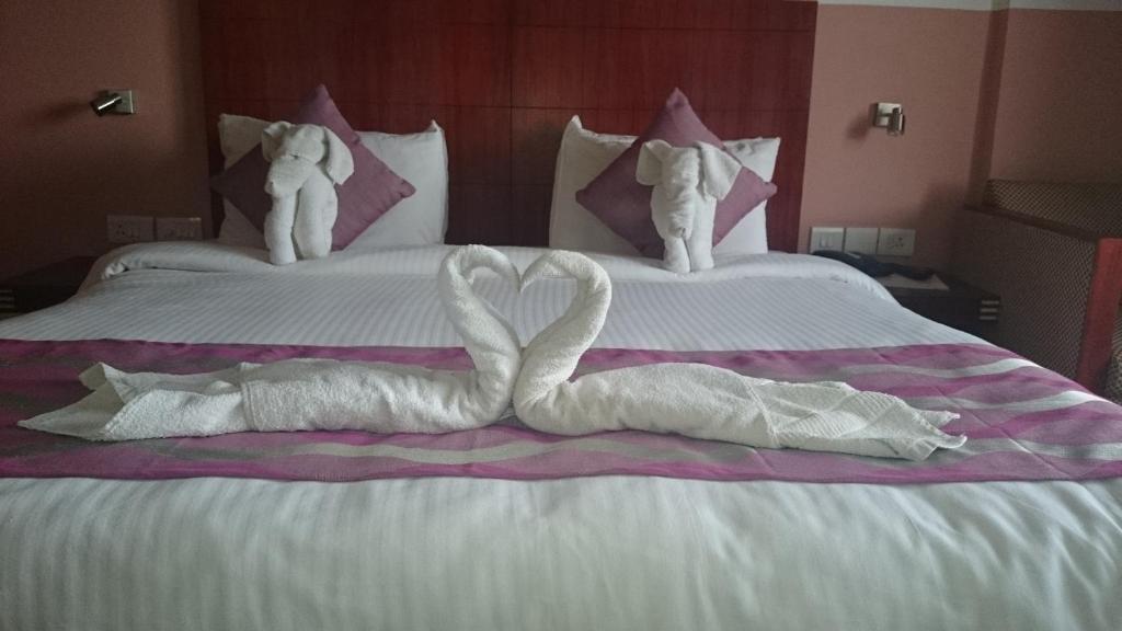 Postel nebo postele na pokoji v ubytování Rain Drops Hotel