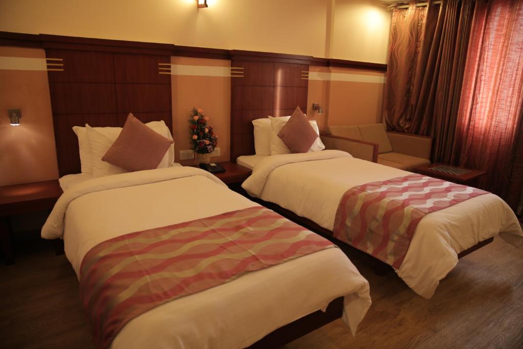 Postel nebo postele na pokoji v ubytování Rain Drops Hotel