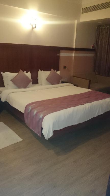 Postel nebo postele na pokoji v ubytování Rain Drops Hotel