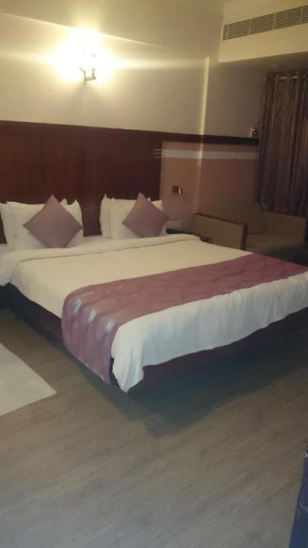 Postel nebo postele na pokoji v ubytování Rain Drops Hotel