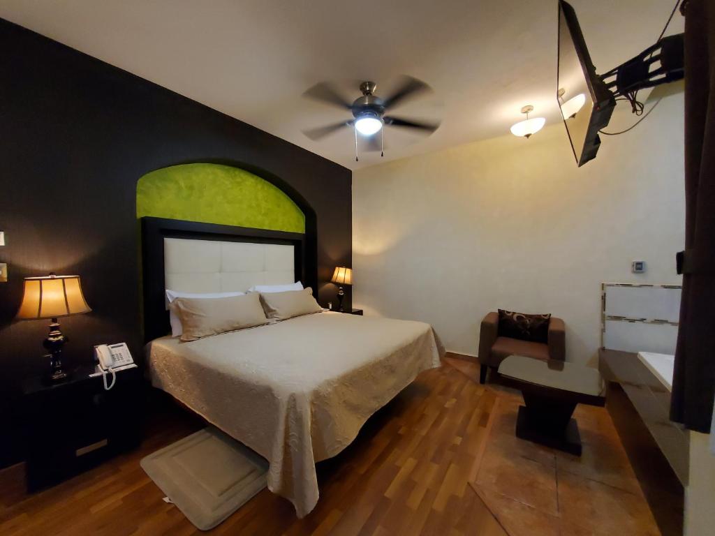 Postel nebo postele na pokoji v ubytování Hotel El Relicario
