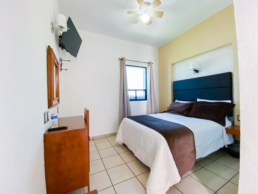 Postel nebo postele na pokoji v ubytování Hotel El Relicario