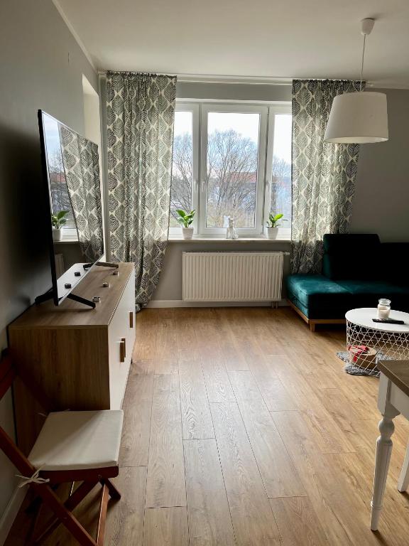 TV a/nebo společenská místnost v ubytování Kościuszki 92 Park Centralny