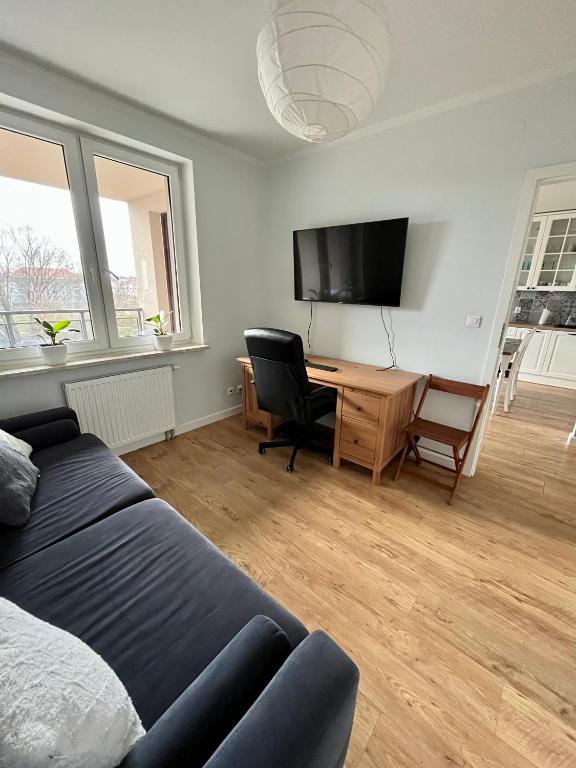 TV a/nebo společenská místnost v ubytování Kościuszki 92 Park Centralny