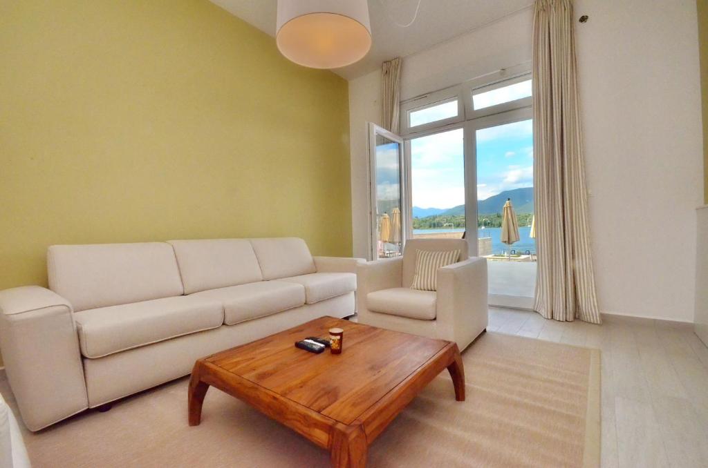 a living room with a couch and a coffee table at Apartments Bojana in Tivat