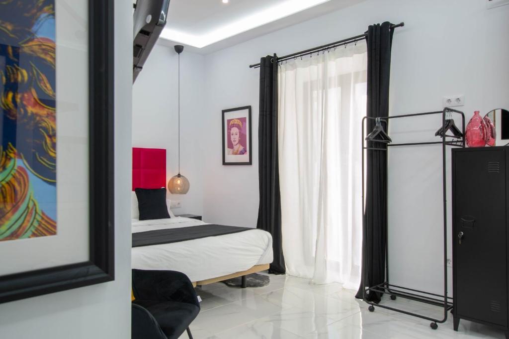 Postel nebo postele na pokoji v ubytování Apartamentos Élite - Art Collection - Andy