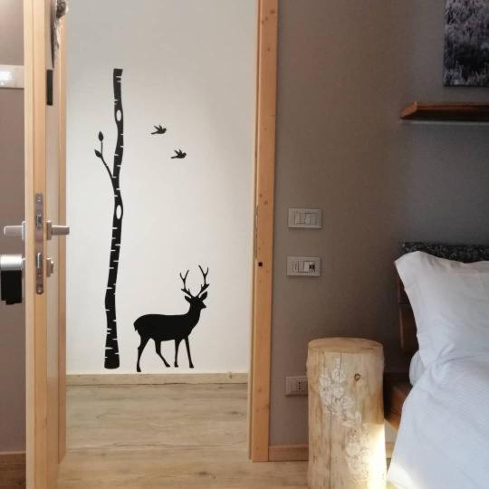 Postel nebo postele na pokoji v ubytování FIOCCO DI NEVE