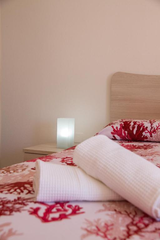 Postel nebo postele na pokoji v ubytování BluRiva Hotel