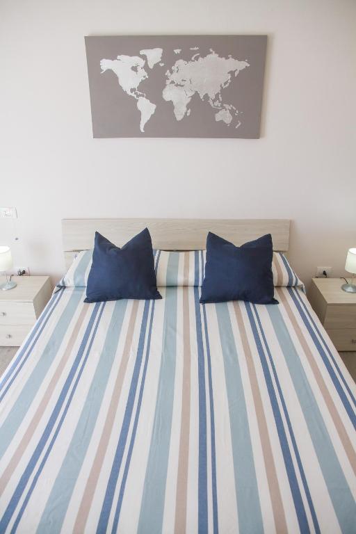Postel nebo postele na pokoji v ubytování BluRiva Hotel
