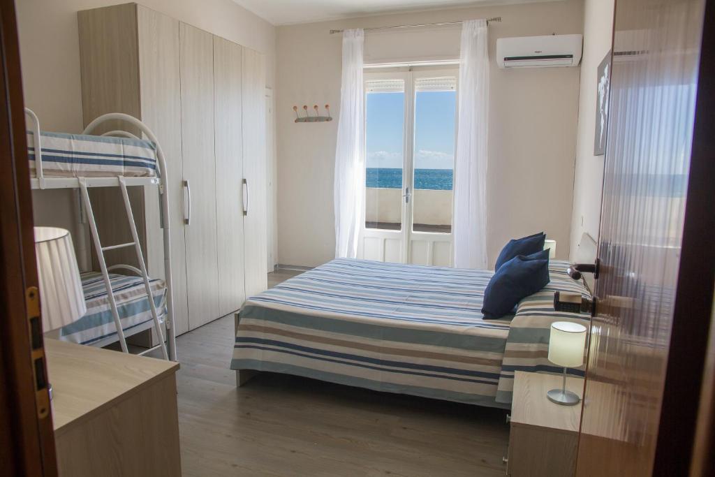 Postel nebo postele na pokoji v ubytování BluRiva Hotel