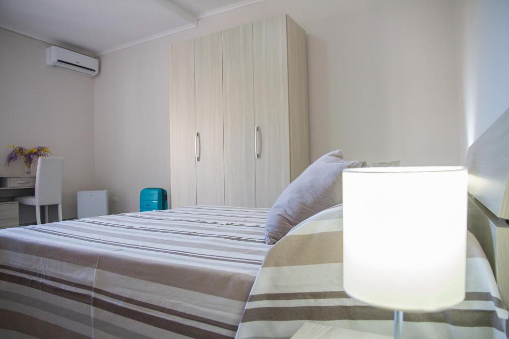Postel nebo postele na pokoji v ubytování BluRiva Hotel