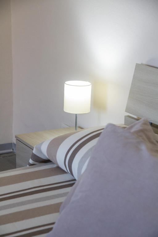Postel nebo postele na pokoji v ubytování BluRiva Hotel
