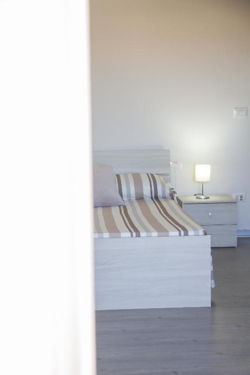 Postel nebo postele na pokoji v ubytování BluRiva Hotel