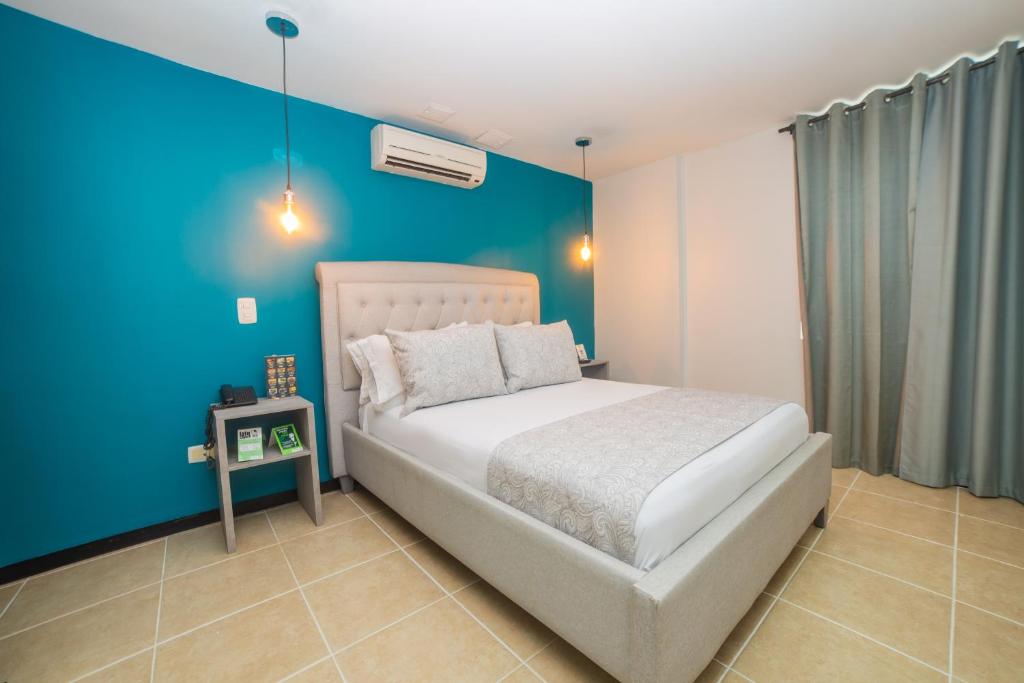 Postel nebo postele na pokoji v ubytování Greenview Medellin By St Hoteles
