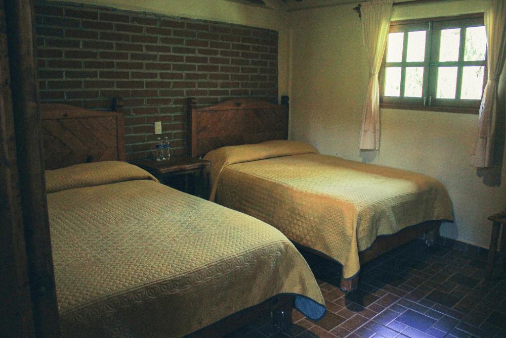 Postel nebo postele na pokoji v ubytování Cabañas Rincón Escondido