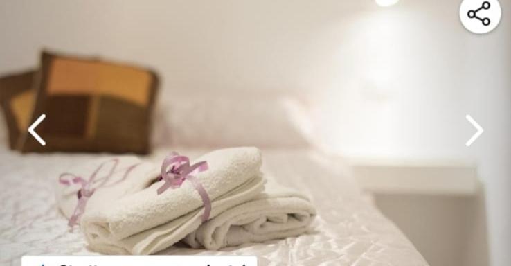 A bed or beds in a room at Appartamento solare