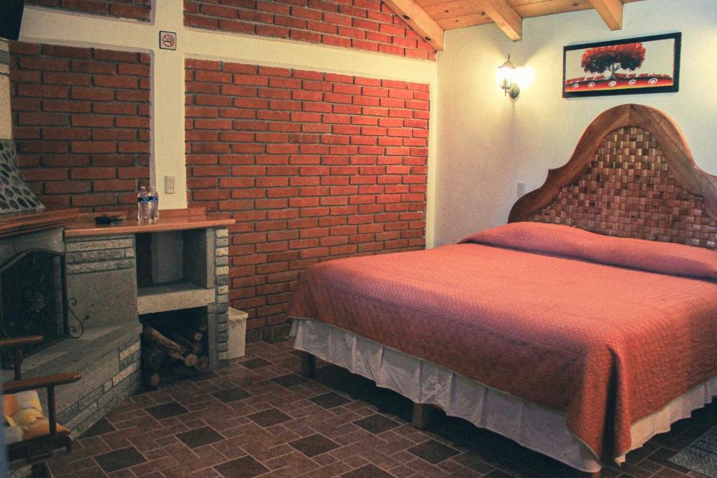 Postel nebo postele na pokoji v ubytování Cabañas Rincón Escondido