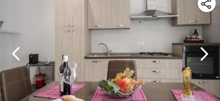 A kitchen or kitchenette at Appartamento solare